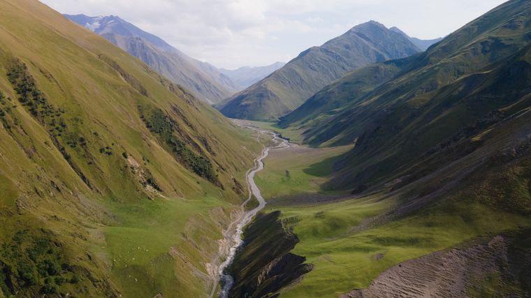 Green valleys and mountain ridges seen from the air — photo by Nadezhda Moryak on Pexels