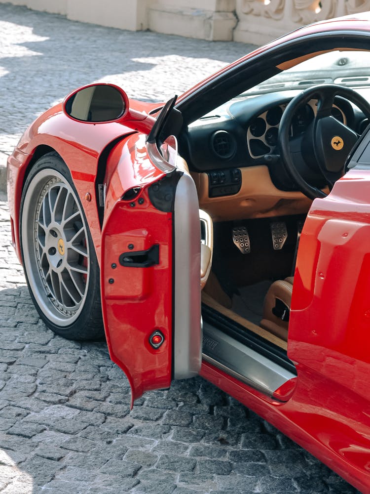 Close Up Photo Of Red Car Door Opened