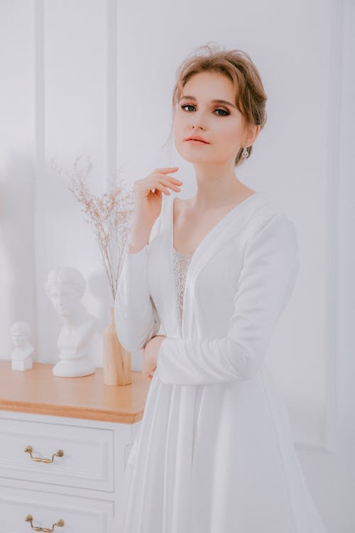 Free A Woman in White Long Sleeve Dress Stock Photo