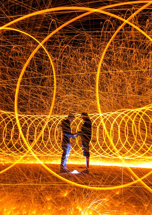 Circles of Lights around People at Night