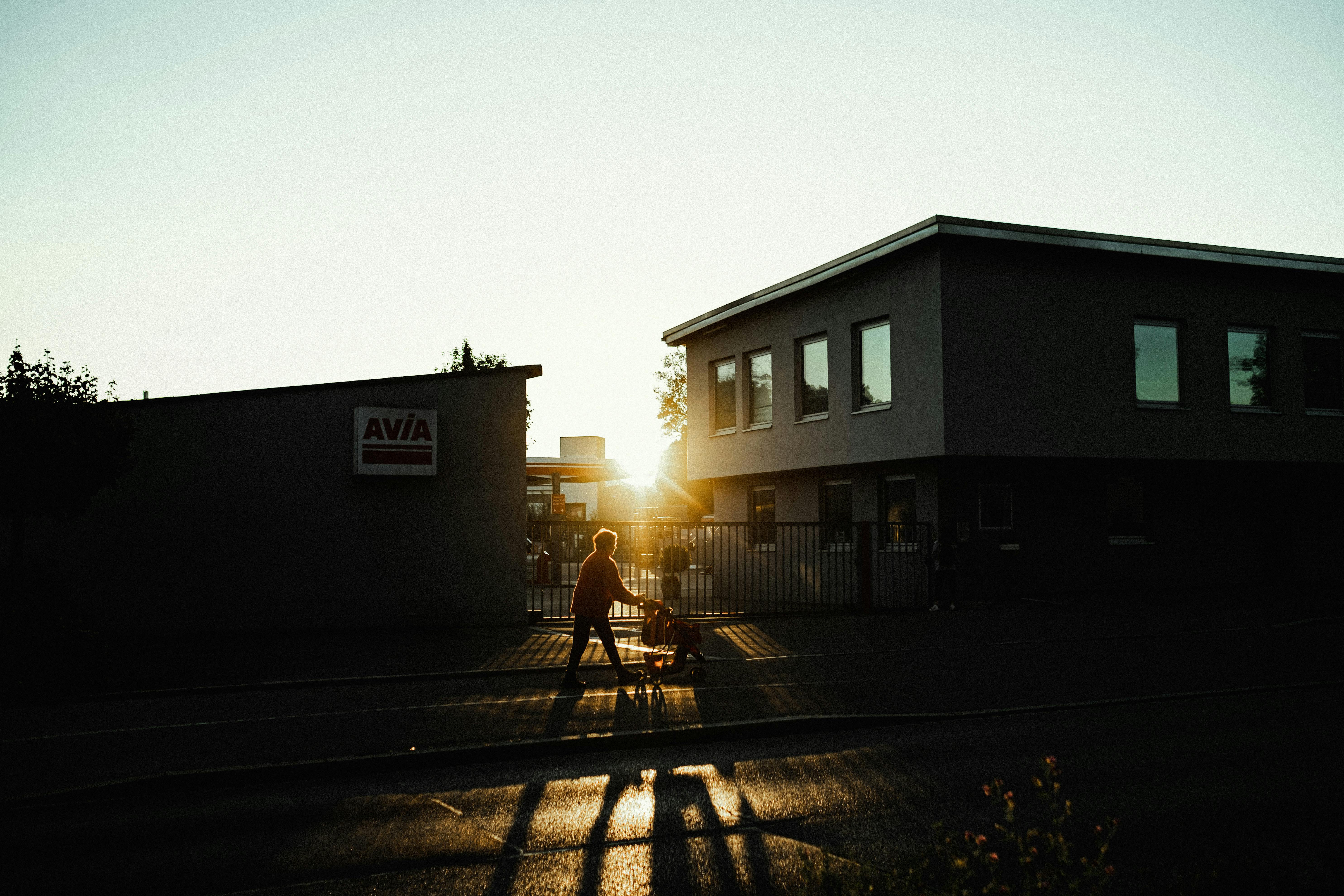 ADHD transition paralysis focus & productivity adhd — person walking outside golden hour light cozy peaceful neighborhood