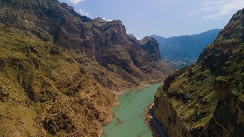 Free Breathtaking view of rugged mountain ranges and a winding river in Dagestan, Russia. Stock Photo