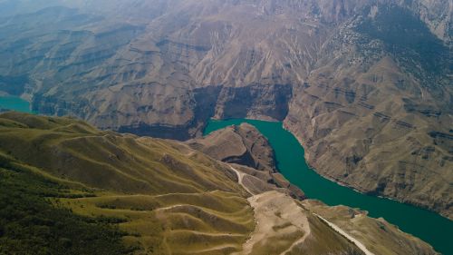 Free A breathtaking aerial view of mountainous landscapes and winding rivers in Dagestan, Russia. Stock Photo