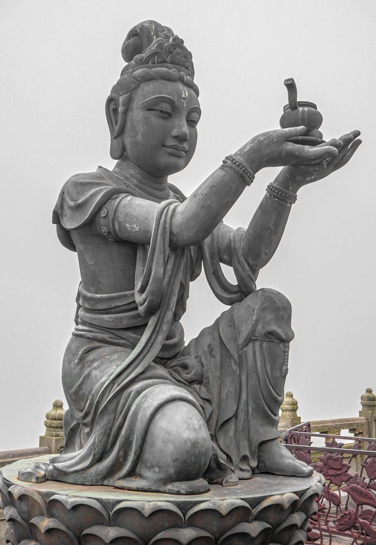 Statue Of Kneeling Buddha