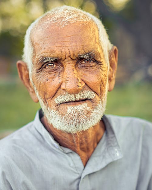 Elderly Man in Gray Button Up Shirt