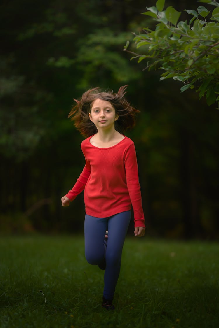 A Girl Running Wearing Red Long Sleeves Shirt 