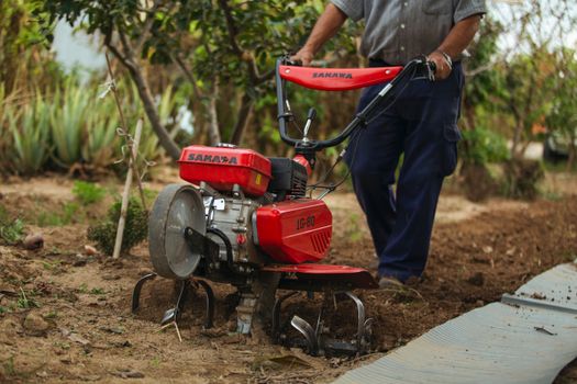 A Hand Operated Land Tilling Machine
Using a Cultivator in Tilling the Soil

