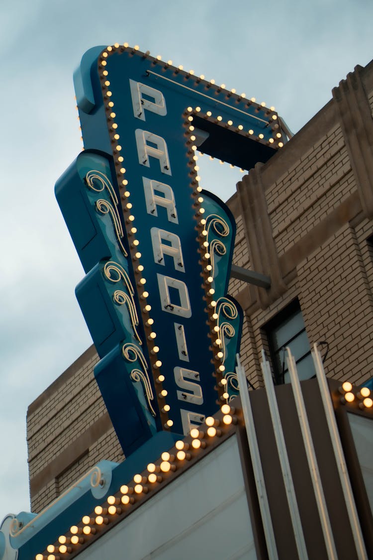 Lighted Business Signage Hanging On A Building