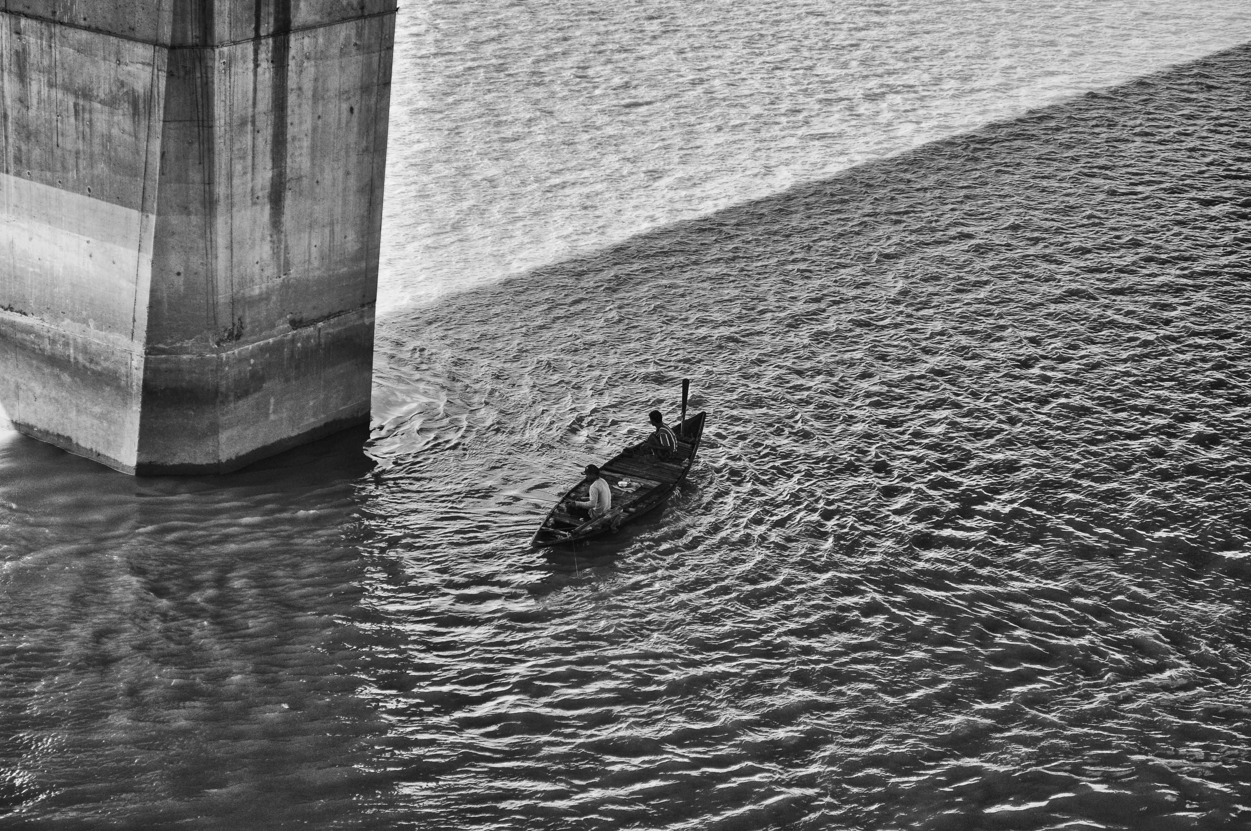 Black and White Photo of People on Boat · Free Stock Photo