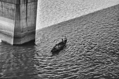 Black and White Photo of People on Boat