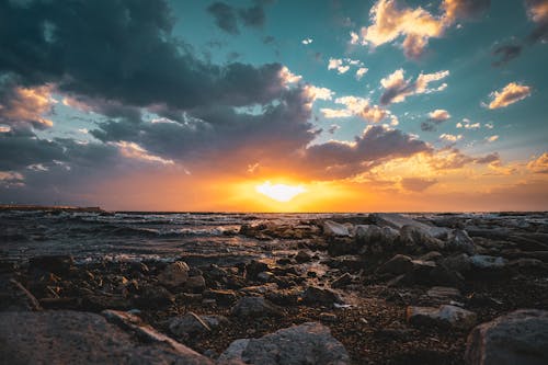 Sunset View in the Horizon from The Rocky Seashore