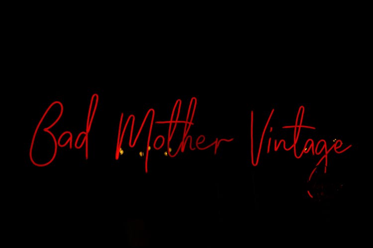 A Bad Mother Vintage Signage In Red Neon Light 