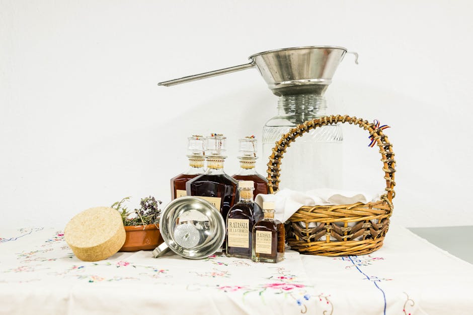Brown Woven Basket Beside Clear Bottle on White Table Clothe