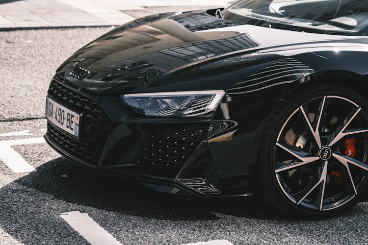 Close Up Photo Of A Black Shinny Car