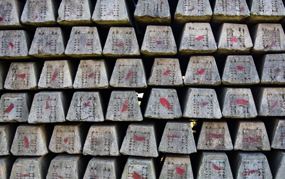 Close-up of stacked concrete blocks with red markings, showcasing industrial texture.