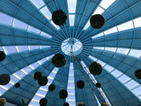 A captivating view of a geometric blue dome ceiling with hanging installations in Antalya.