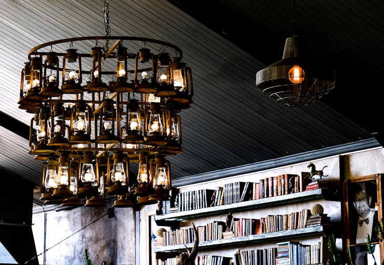 Antique Chandelier Near Book Shelves 