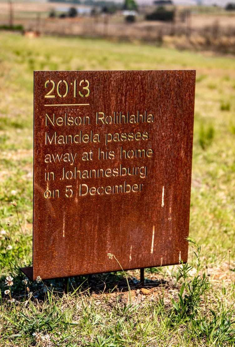 Rusty Memorial Plate On Grass