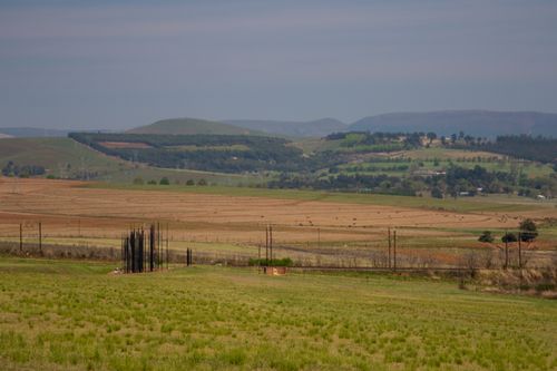 Free Serene rural panorama showcasing the rolling hills and fields of South Africa. Stock Photo