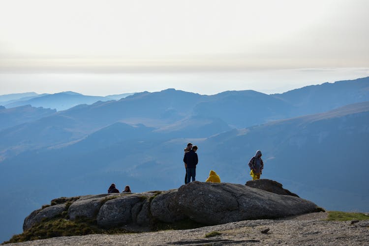 People On Rocks On A Mountaintop