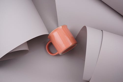 Free Orange Ceramic Mug on White Table Stock Photo