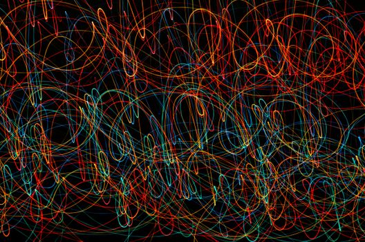 Vivid abstract pattern of colorful light trails creating a mesmerizing design.
