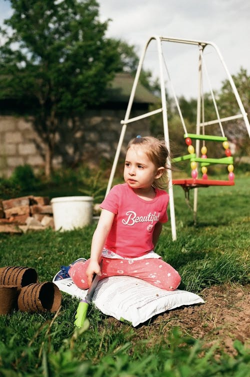 Girl Sitting on a Sack