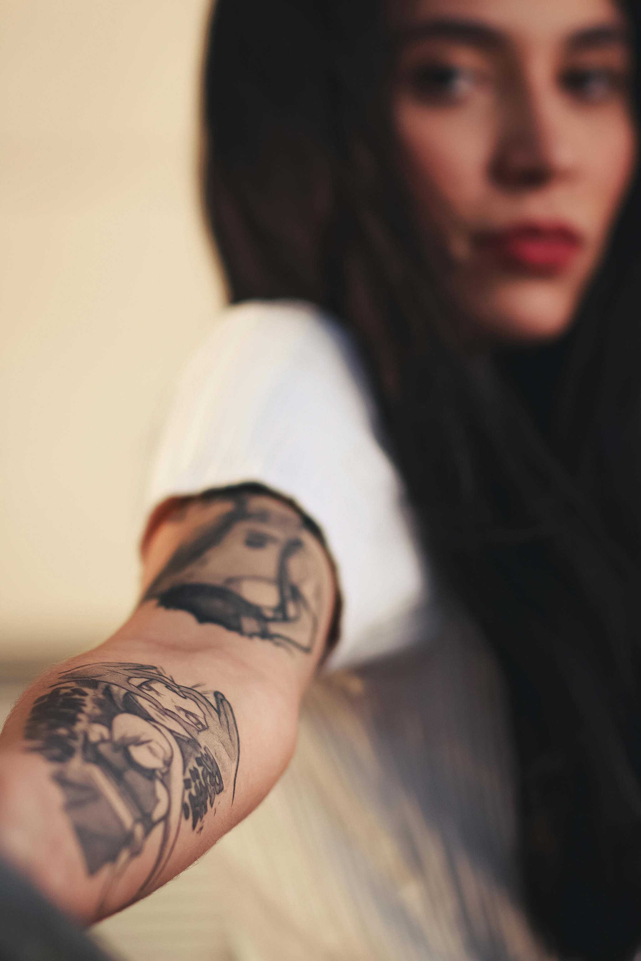 Woman With Tattoos on her Arm · Free Stock Photo