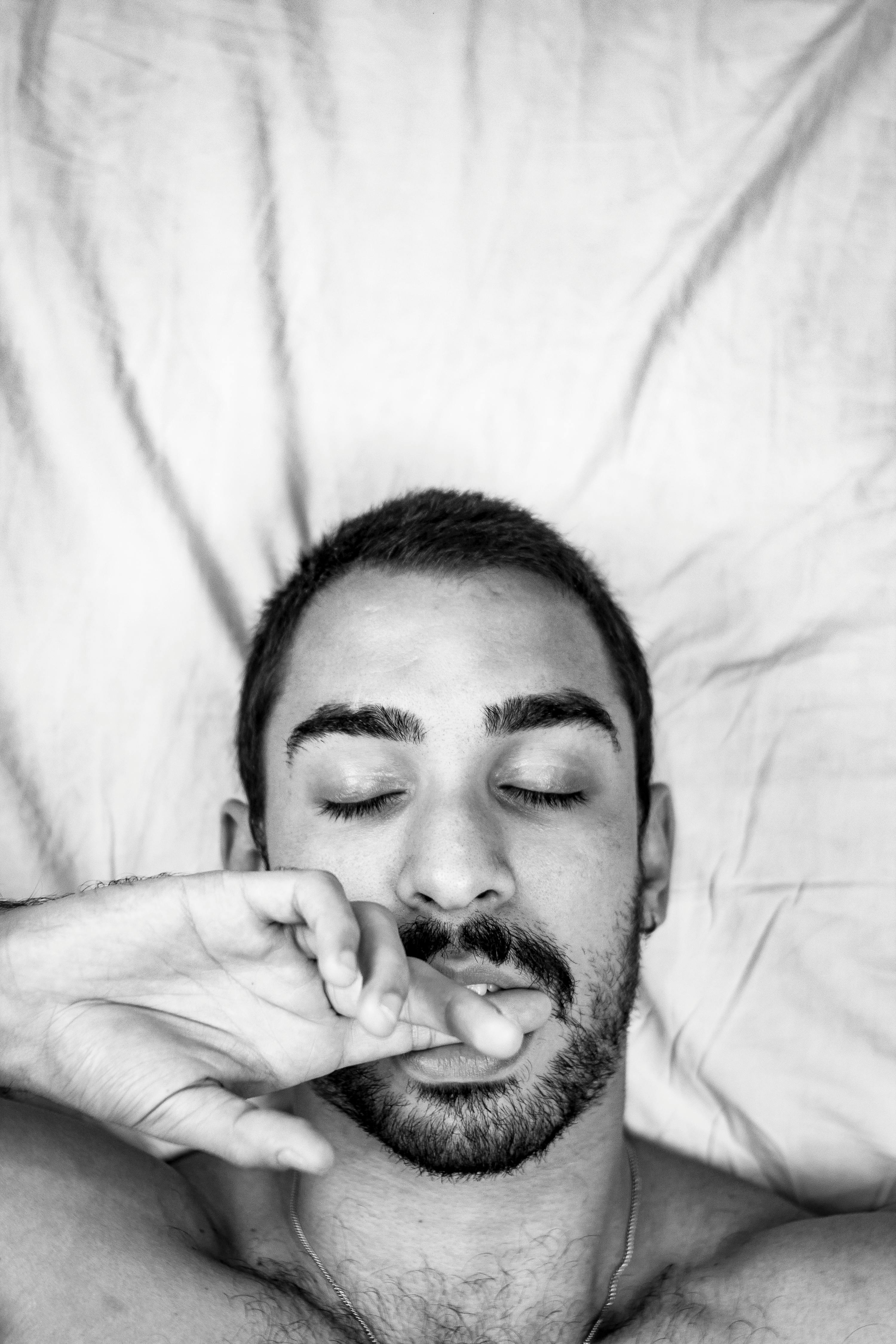 A Man Lying Down On The Floor Free Stock Photo a-man-lying-down-on-the-floor-free-stock-photo