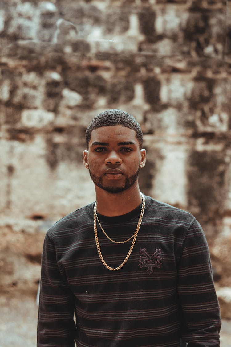 A Man Wearing Chain Necklaces 