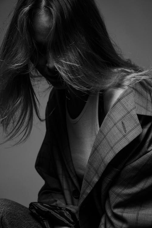 Free A Grayscale Photo of a Woman Wearing a Blazer Stock Photo