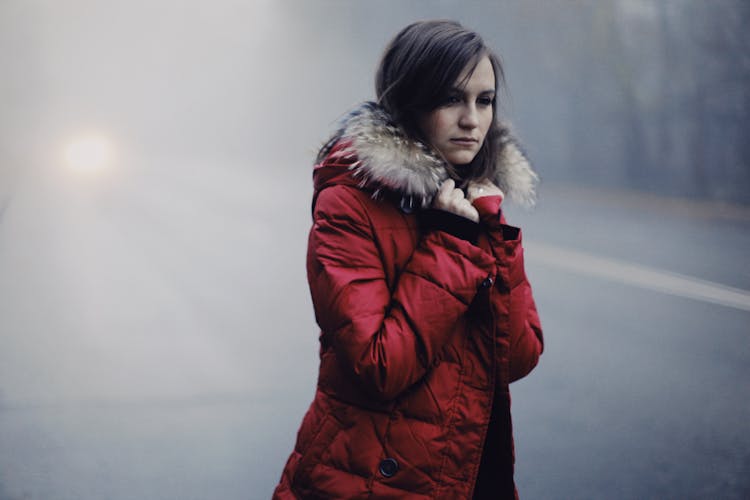 Woman Wearing A Red Parka Jacket