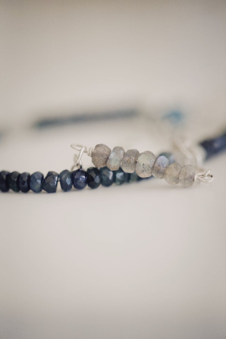 Close-Up Shot Of Silver And Blue Beaded Bracelets