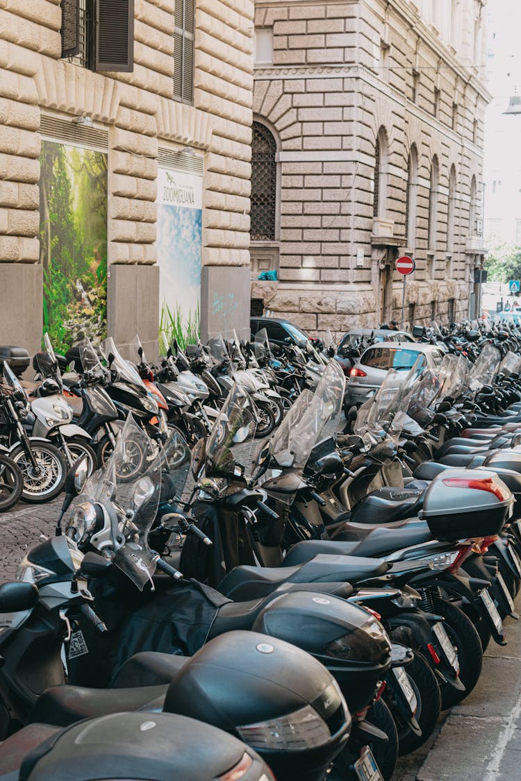 Rows Of Motorcycles Standing In Street At Public Building