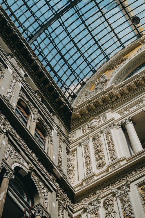Free Low angle view of the ornate interior and glass roof of Galleria Umberto I in Naples, Italy. Stock Photo