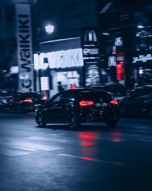 Black Car on the Road at Night Time