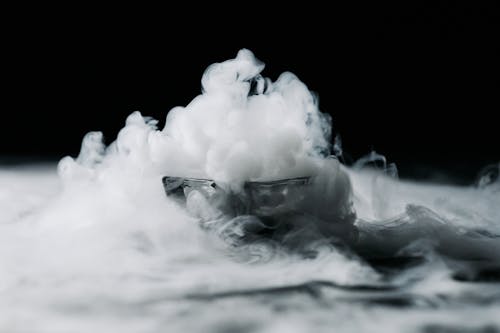 A Thick White Smoke Against Black Background