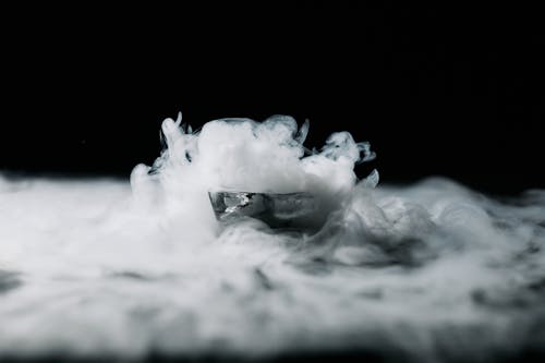 A Thick White Smoke Against Black Background