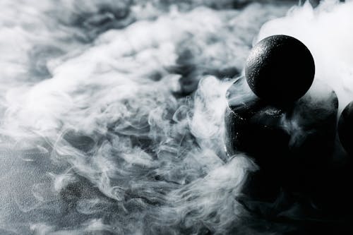 A Black Ball Surrounded by Smoke