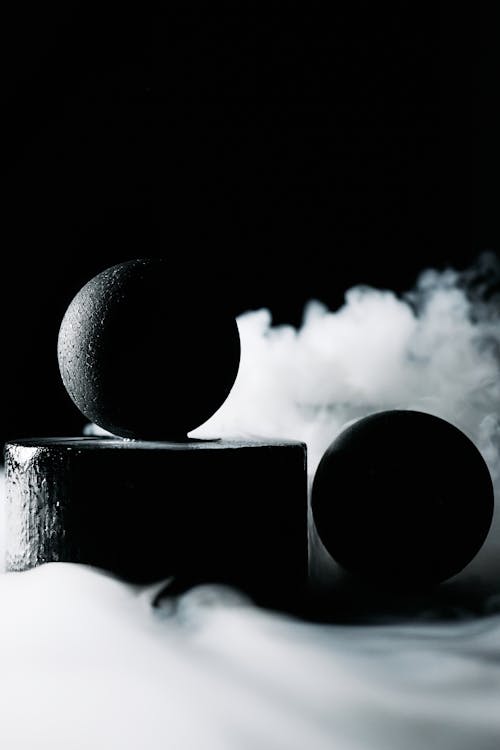 Black Balls Surrounded by Smoke