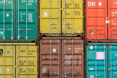Cargo containers stacked in shipping yard