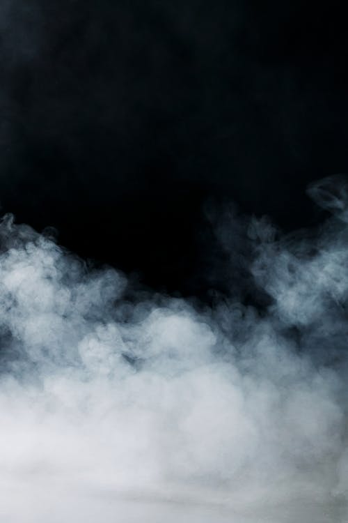 Foto profissional grátis de fumaça, texturas, tiro vertical