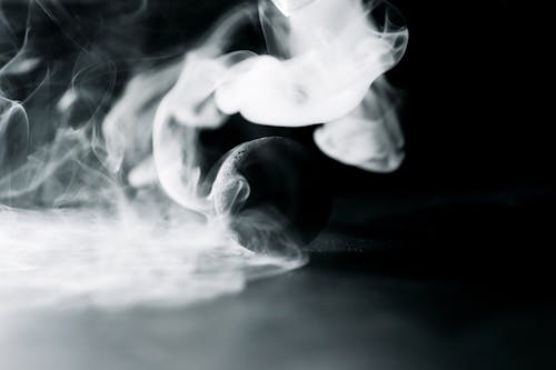 A Black Ball Surrounded by Smoke