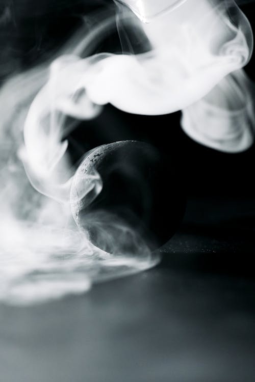 A Black Ball Surrounded by Smoke