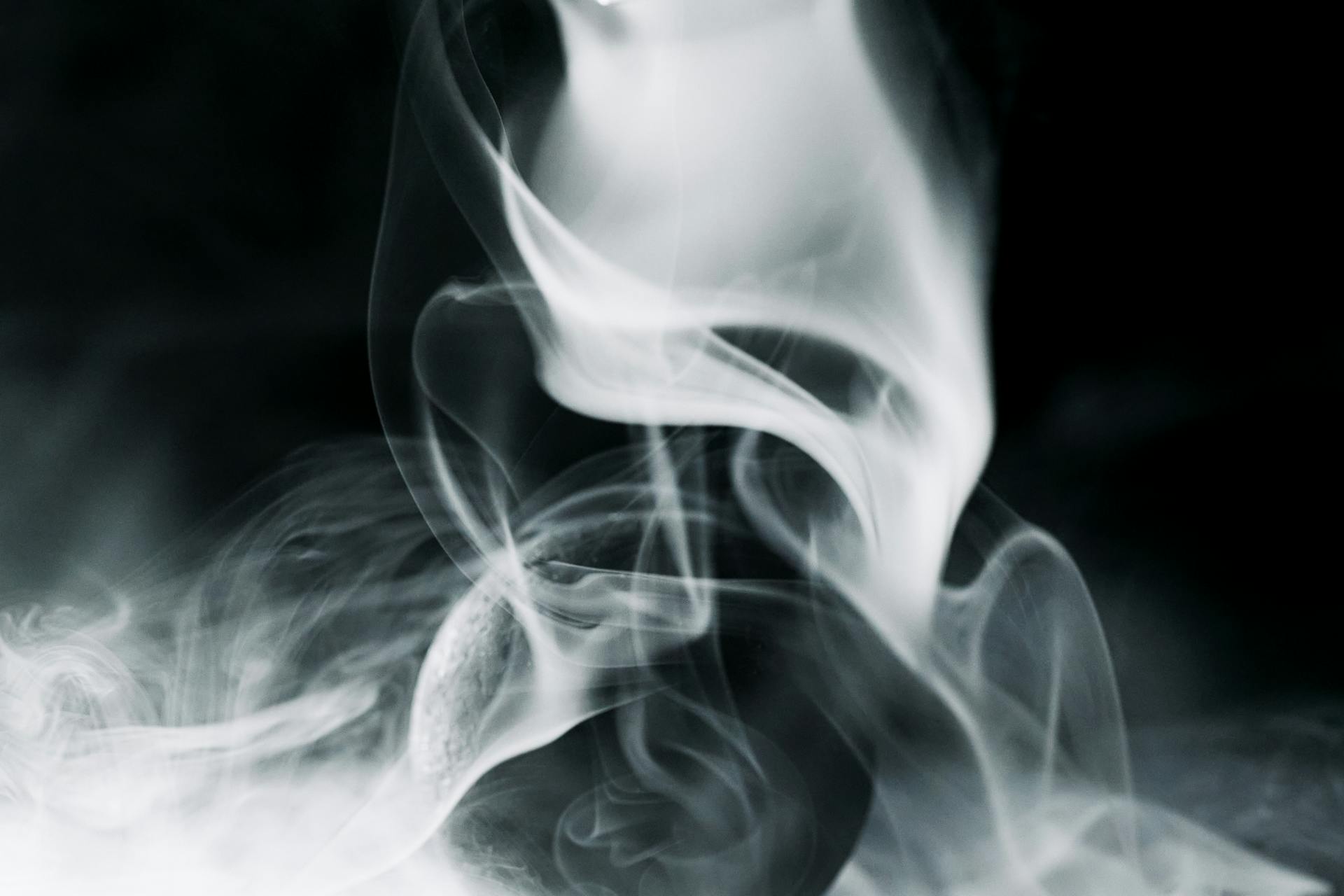 A Black Ball Surrounded by Smoke