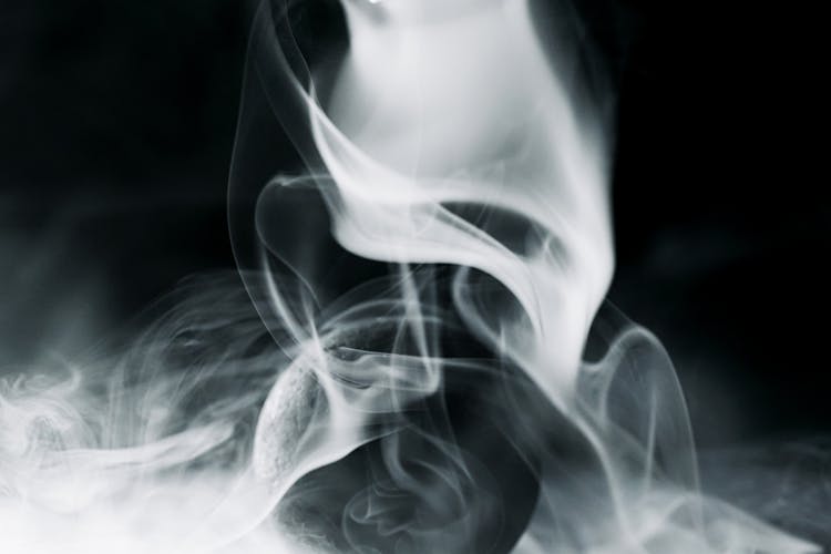 A Black Ball Surrounded By Smoke