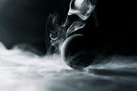 A Black Ball Surrounded by Smoke