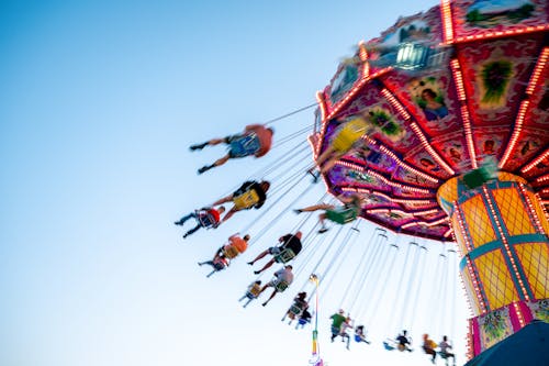 People Riding on Swing Ride