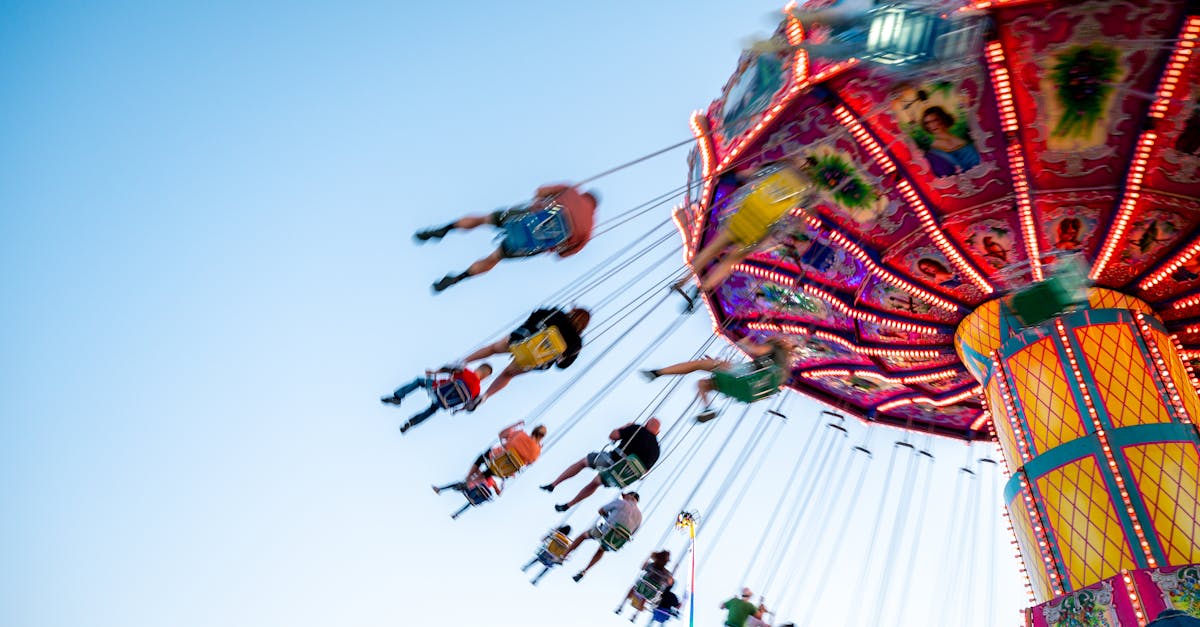 People Riding on Swing Ride · Free Stock Photo