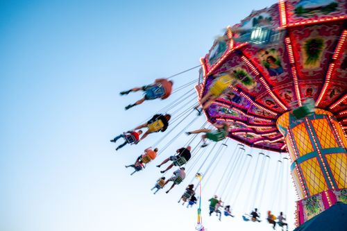 Free Vibrant swing ride spinning at a fairground in Boise, offering an exhilarating experience. Stock Photo